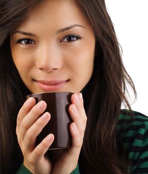 Drinking coffee. Beautiful mixed asian / caucasian woman drinking coffee or tea