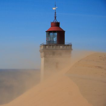 Lighthouse in the sand dunes of Rubjerg Knude in Denmark