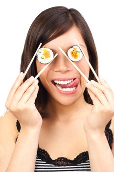 Sushi. Woman making fun with sushi. Funny healthy eating concept. Beautiful mixed chinese / caucasian model isolated on white background.