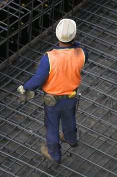 One builder standing on wire mesh
