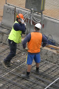 Two construction men at a worksite
