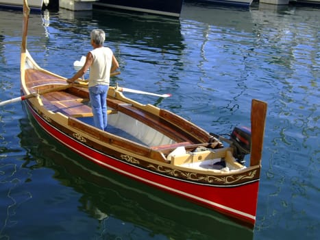 Oarsman on a traditional Malta boat known as a dghajsa