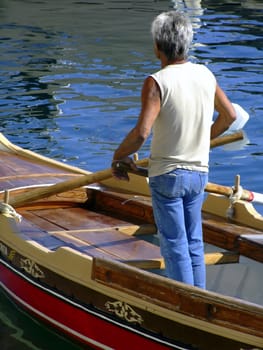 Oarsman on a traditional Malta boat known as a dghajsa