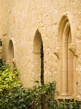 A medieval limestone facade in traditional baroque style in Mdina on the island of Malta