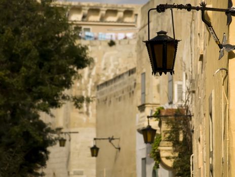A medieval limestone facade in traditional baroque style in Mdina on the island of Malta