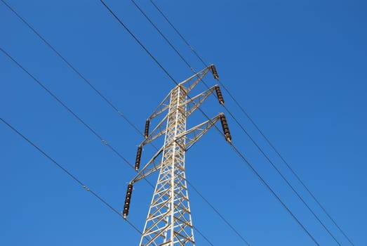 Electrical tower on a background of the blue sky