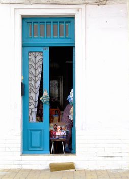 Quaint little typical Malta door of house holding a bazaar sale