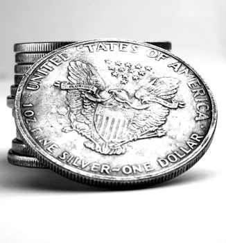 Stack of old dollars and coins