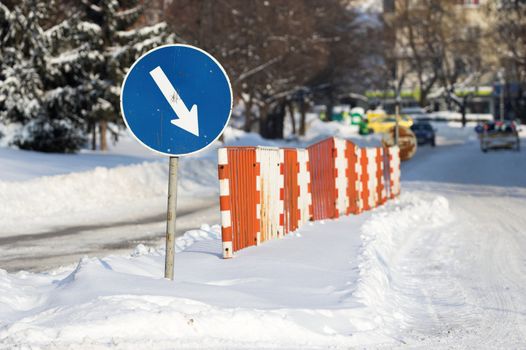 A road mark and snow covered way