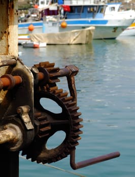 Old quayside hoist crane in Malta, used to lift fish catches off fishing trawlers.