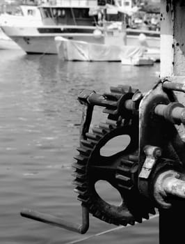 Old quayside hoist crane in Malta, used to lift fish catches off fishing trawlers.