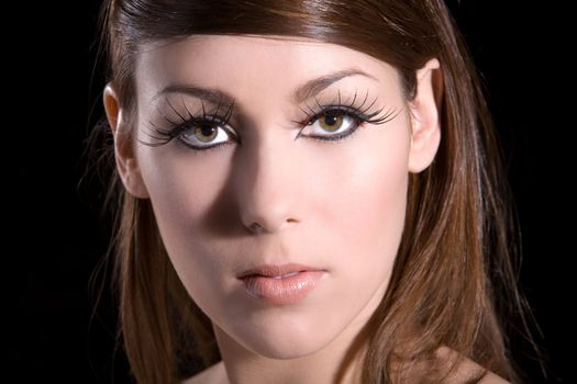 beautiful brunette with long fake eye lashes