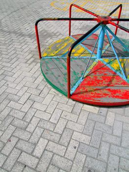 Vintage merry-go-round at deserted playground in Malta