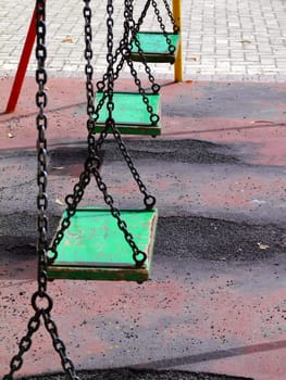 Vintage and old swingset at deserted playground in Malta