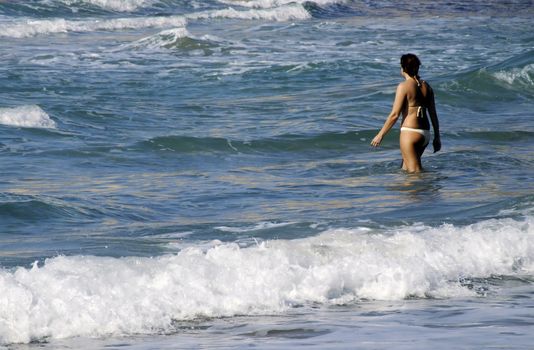 Woman in bikini at the beach in the Mediterranean