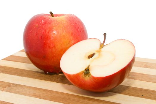 Red apples on chopping board