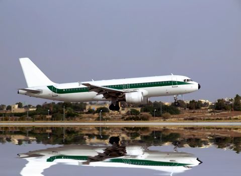 Civil aircraft jet landing on an airport runway in Malta