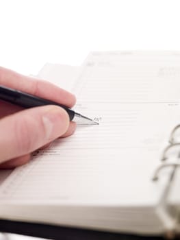 Man writing in an Personal Organizer, short focal lenght