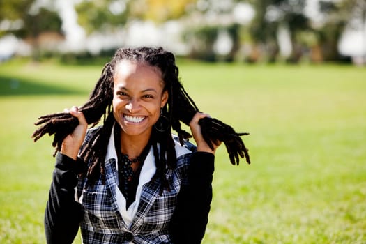 A young African American woman having fun - isolated on green