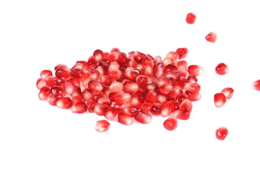 Pomegranate grains in a plate shot close-up