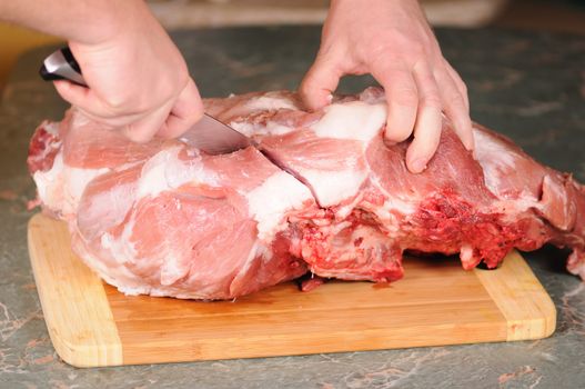 cutting of the big piece of meat