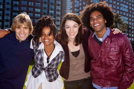 A group of people in front of an apartment building taken into the sun with solar flare