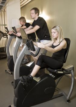 Three people spinning with a girl in focus