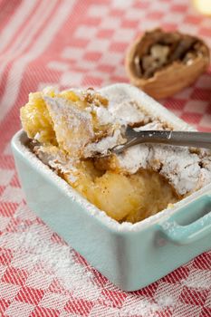 Delicious apple clafoutis with cinnamon and walnuts