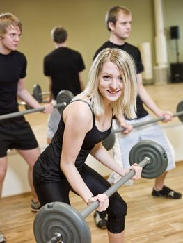 Girl lifting weights at the gym