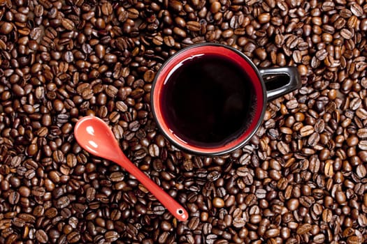 cup of coffee with coffee beans