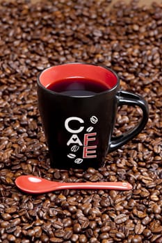 cup of coffee with coffee beans
