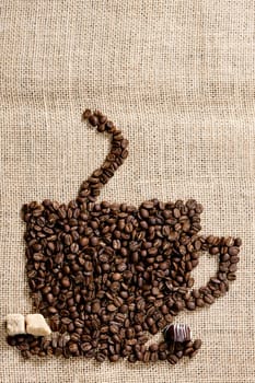cup of coffee made of coffee beans with sugar and chocolate