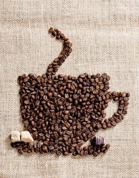cup of coffee made of coffee beans with sugar and chocolate