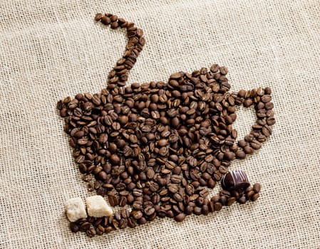 cup of coffee made of coffee beans with sugar and chocolate