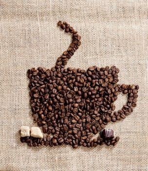 cup of coffee made of coffee beans with sugar and chocolate