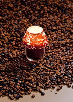 still life of candle and coffee beans