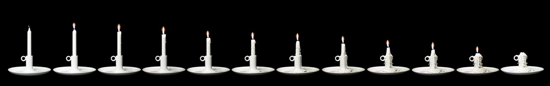 Candle burning down in 12 steps against a black background