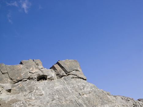 Rock formation against a clear blue sky