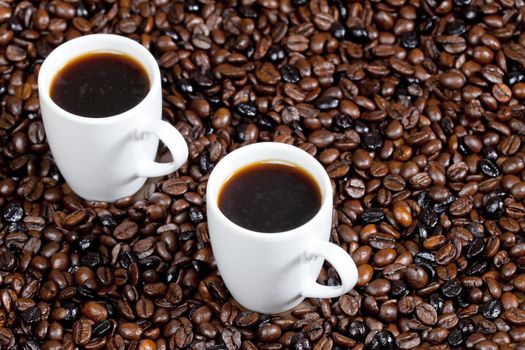 still life of coffee cups and coffee beans