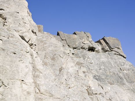 Rock formation against a clear blue sky