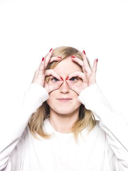 Girl makes a funny facial expression isolated on a white background