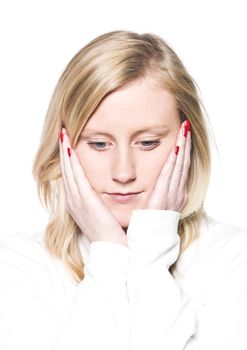 Girl leaning her head in her hands over white