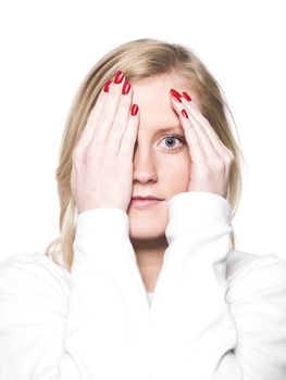 Portrait of a young woman hiding in her hands i solated on white