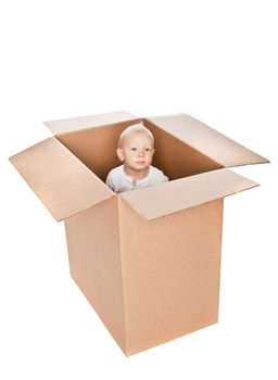 Baby boy in a box isolated against a white background