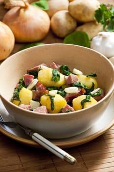 potatoes with smoked meat, spinach and garlic