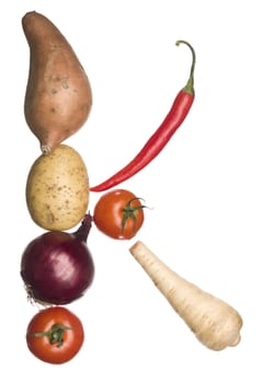 The letter 'K' made out of vegetables isolated on a white background