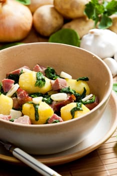 potatoes with smoked meat, spinach and garlic
