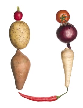 The letter 'U' made out of vegetables isolated on a white background