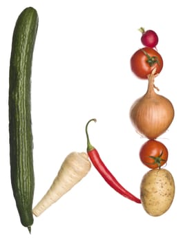 The letter 'W' made out of vegetables isolated on a white background