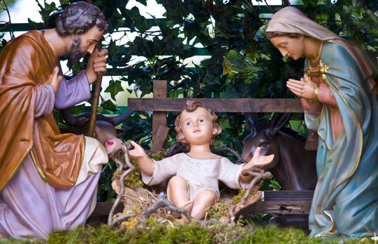 statues of the Holy Family in a crib